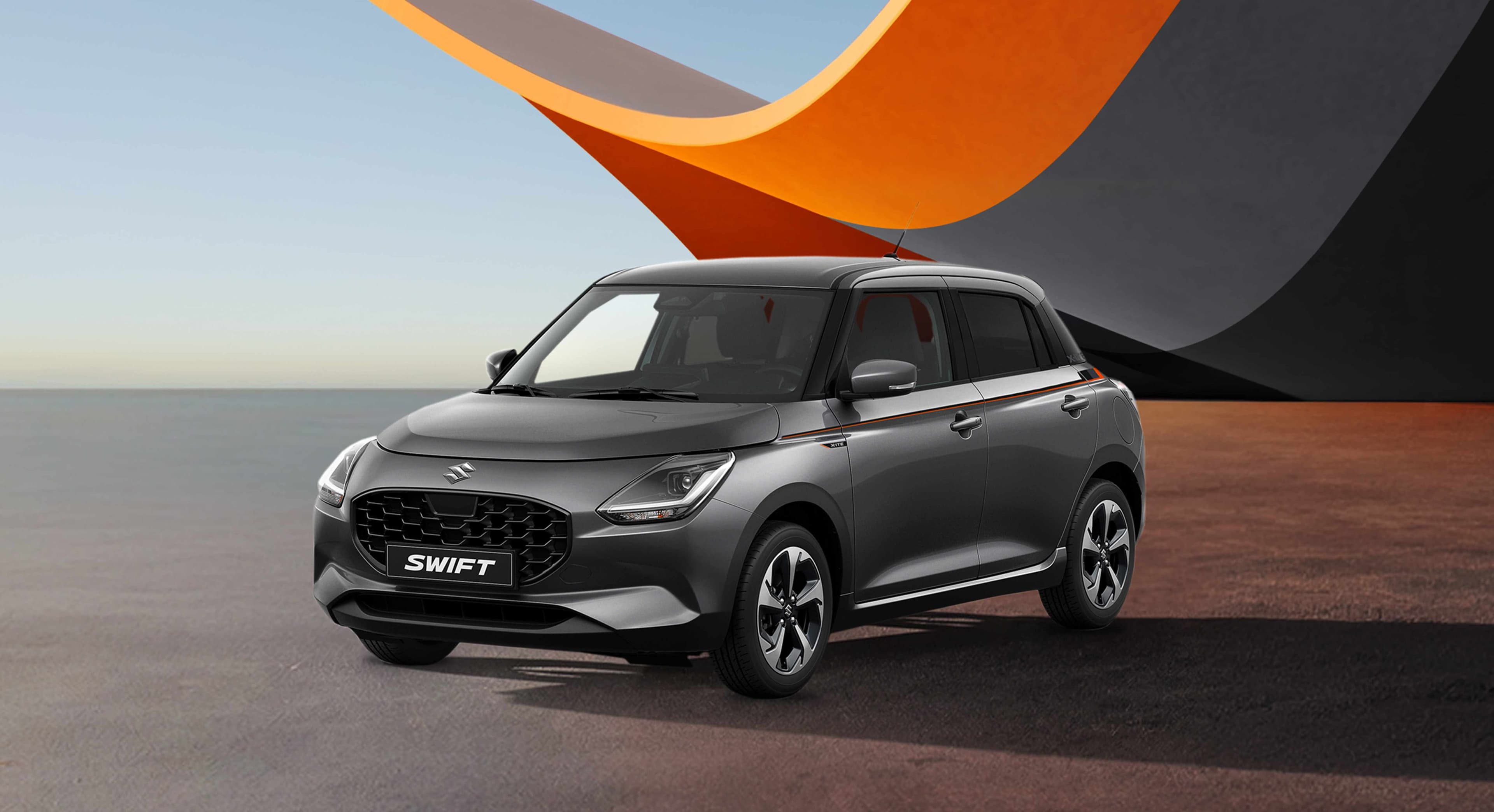 Suzuki Swift X-ITE in grauer Lackierung, schräg von vorne vor stilisiertem Hintergrund.