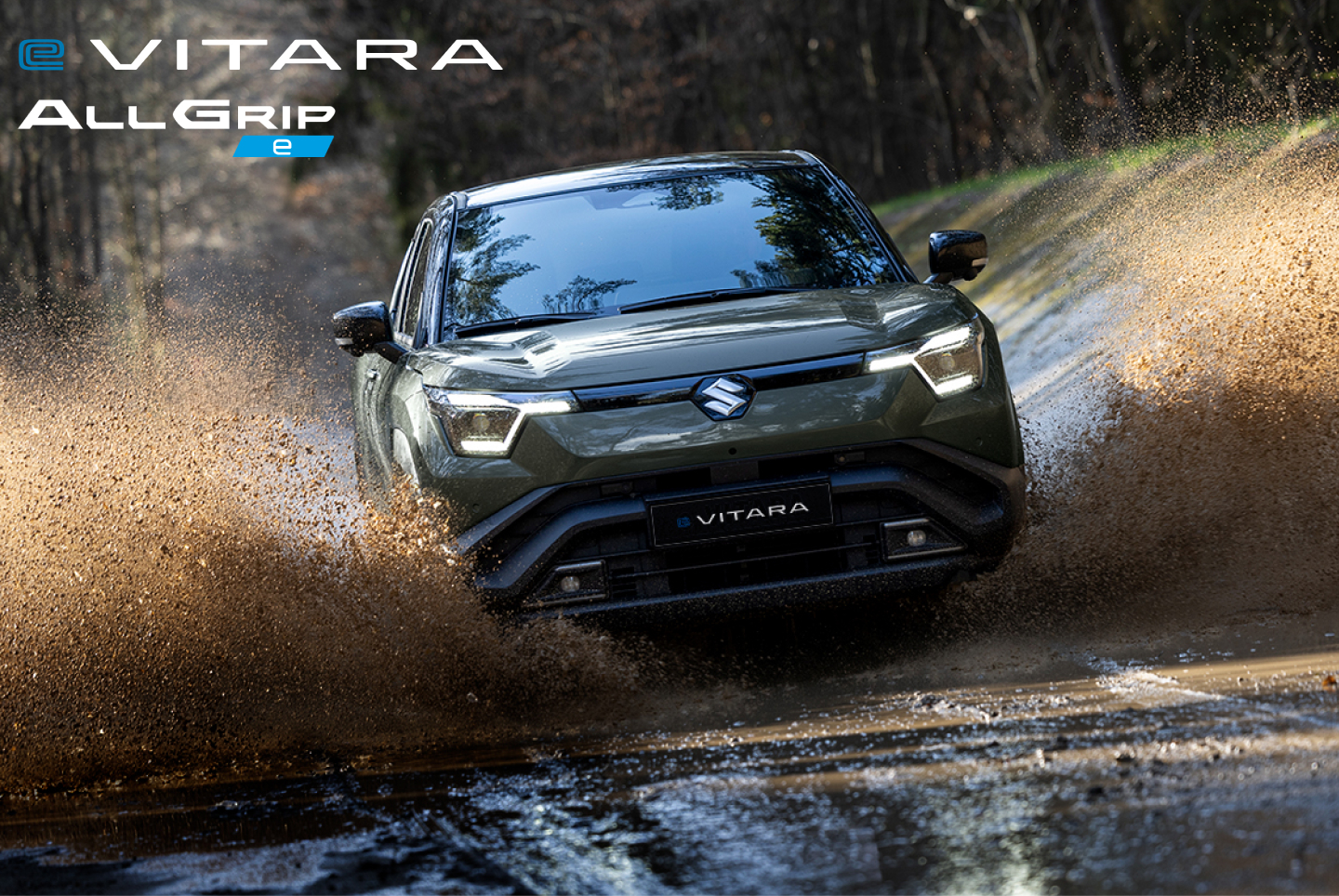 Grüner Suzuki e&nbsp;VITARA fährt über eine Brücke